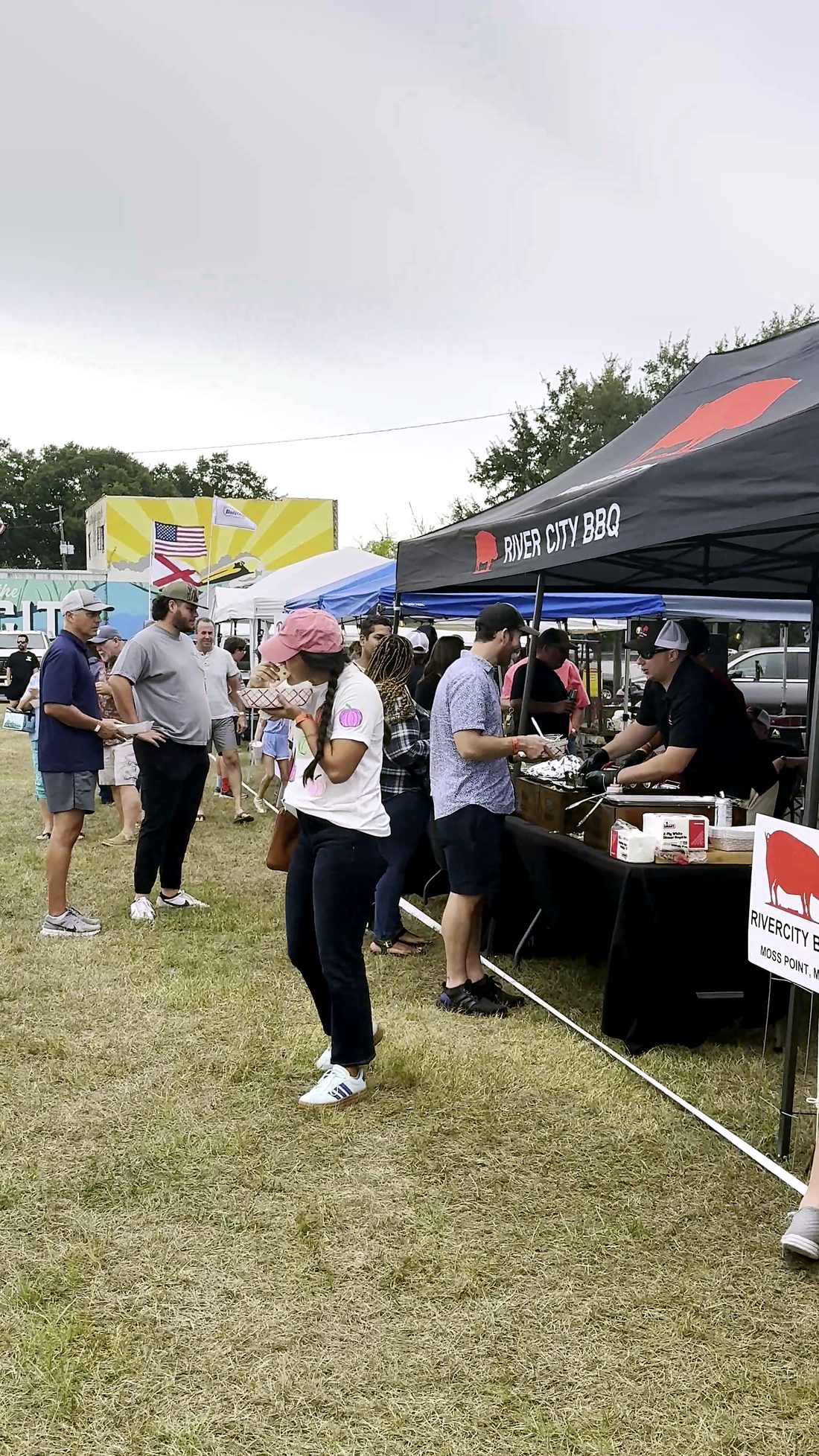 Crowds browsing the vendor tents on the festival grounds